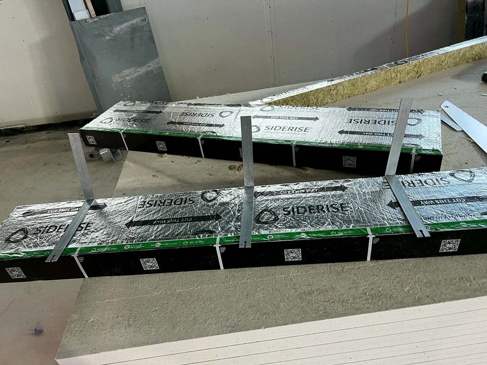 Cavity barriers with fixing brackets prepared before installation