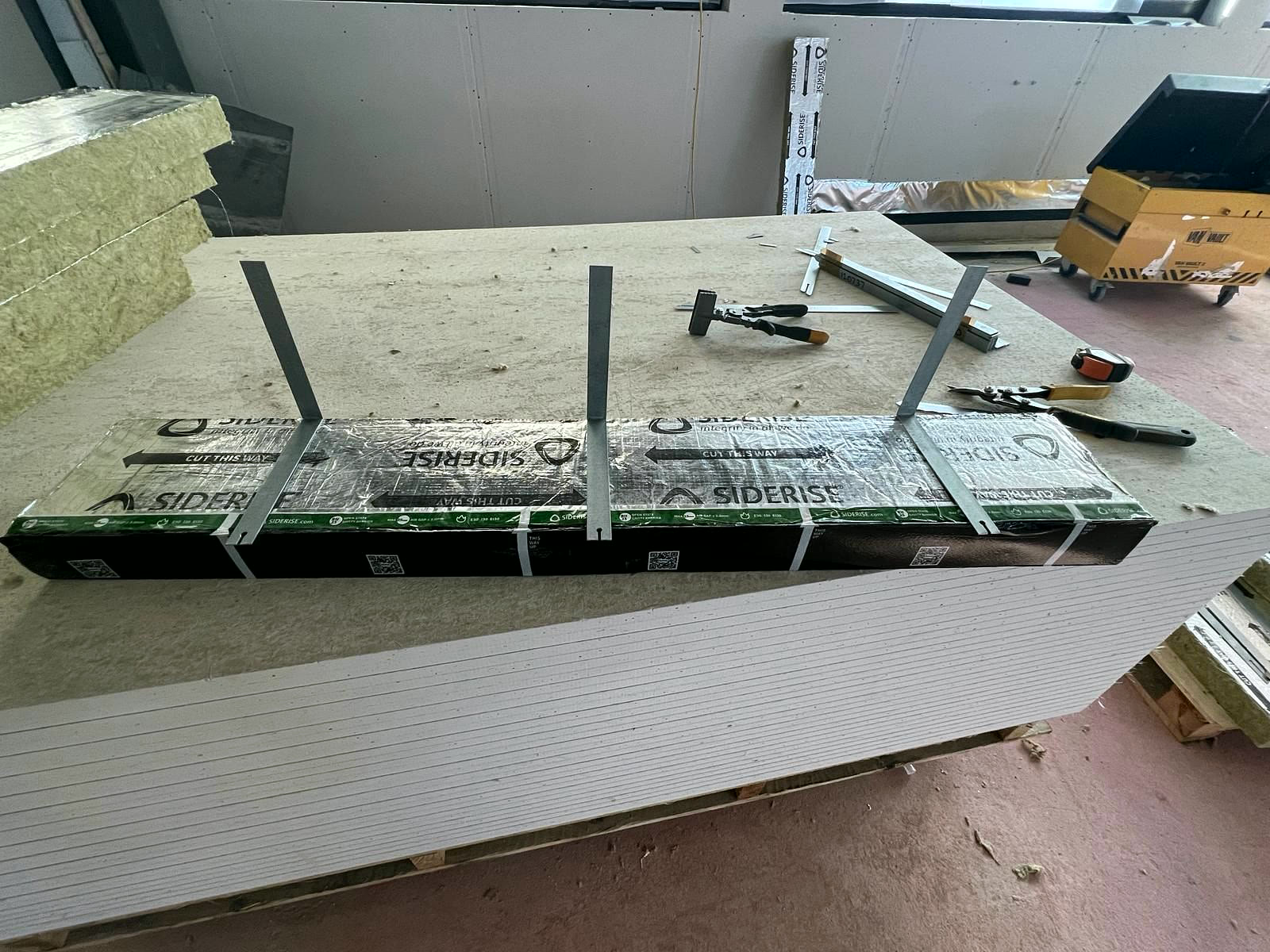 Cavity barriers cut and fitted with brackets on the work bench